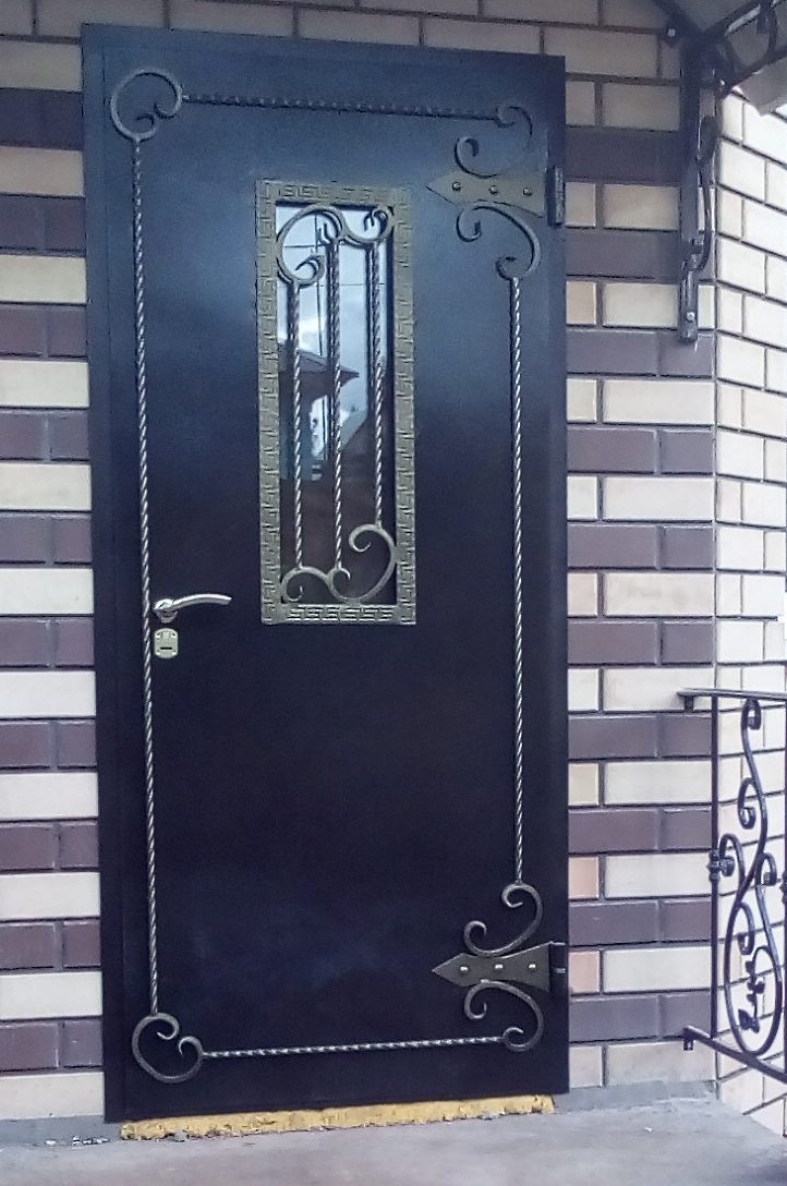 Дверь металлическая с ковкой